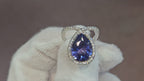 18k White + Yellow Gold with a Ceylon Purple Blue Sapphire Sounded in a Unique Diamond Swirl.