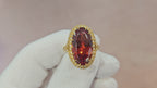 Fine, large Madagascar Spessartite in hand carved 18ky gold with .83cts of diamonds