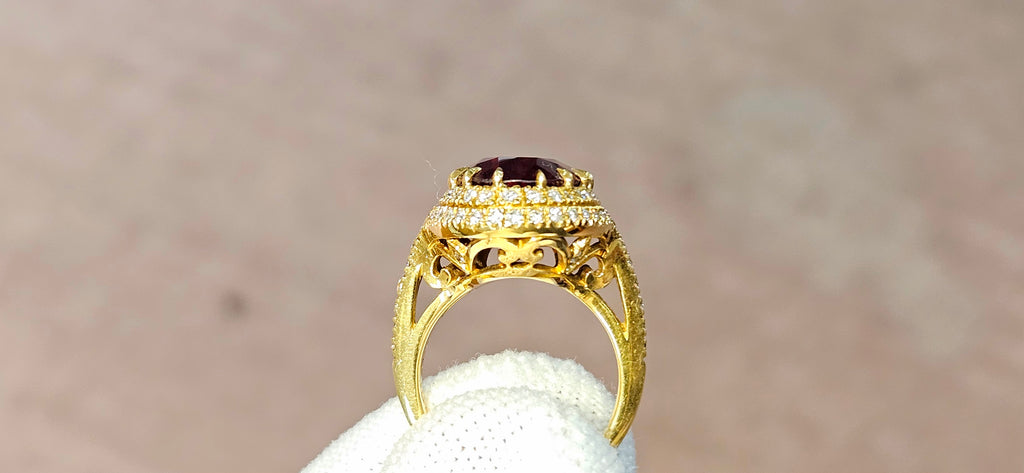 Fine, large Madagascar Spessartite in hand carved 18ky gold with .83cts of diamonds