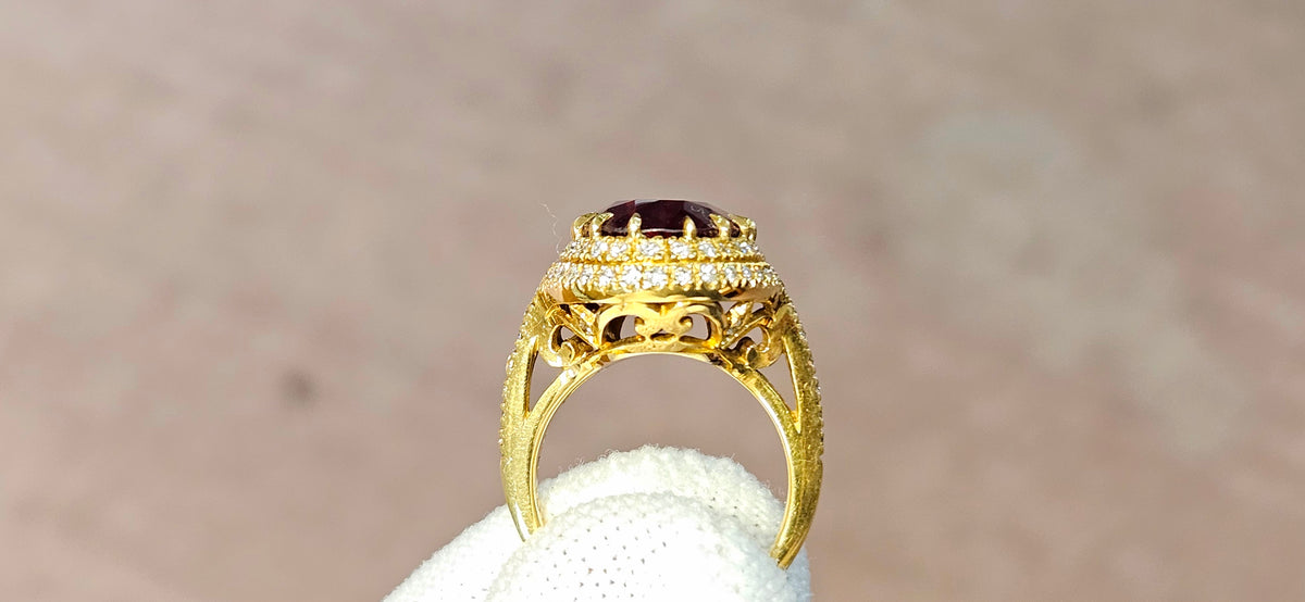 Fine, large Madagascar Spessartite in hand carved 18ky gold with .83cts of diamonds