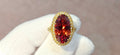 Fine, large Madagascar Spessartite in hand carved 18ky gold with .83cts of diamonds