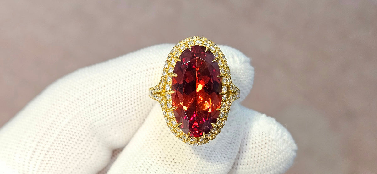 Fine, large Madagascar Spessartite in hand carved 18ky gold with .83cts of diamonds