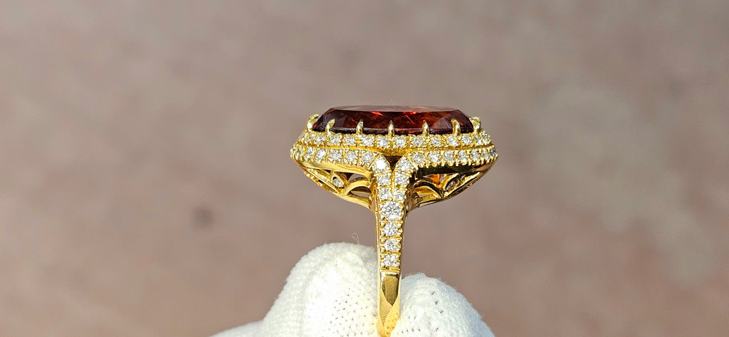 Fine, large Madagascar Spessartite in hand carved 18ky gold with .83cts of diamonds