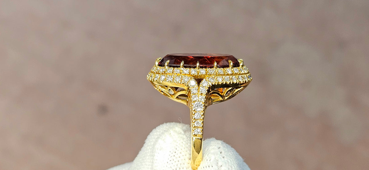 Fine, large Madagascar Spessartite in hand carved 18ky gold with .83cts of diamonds