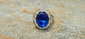 Gem blue 7.76ct Tanzanite ring in 18kw with .48cts of diamonds
