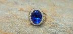 Gem blue 7.76ct Tanzanite ring in 18kw with .48cts of diamonds