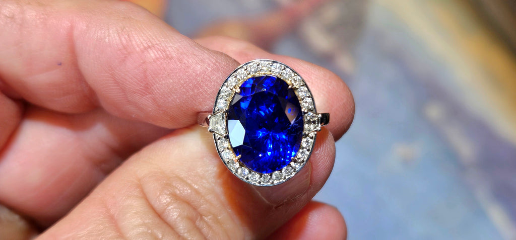 Gem blue 7.76ct Tanzanite ring in 18kw with .48cts of diamonds