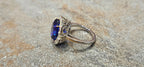 Gem blue 7.76ct Tanzanite ring in 18kw with .48cts of diamonds