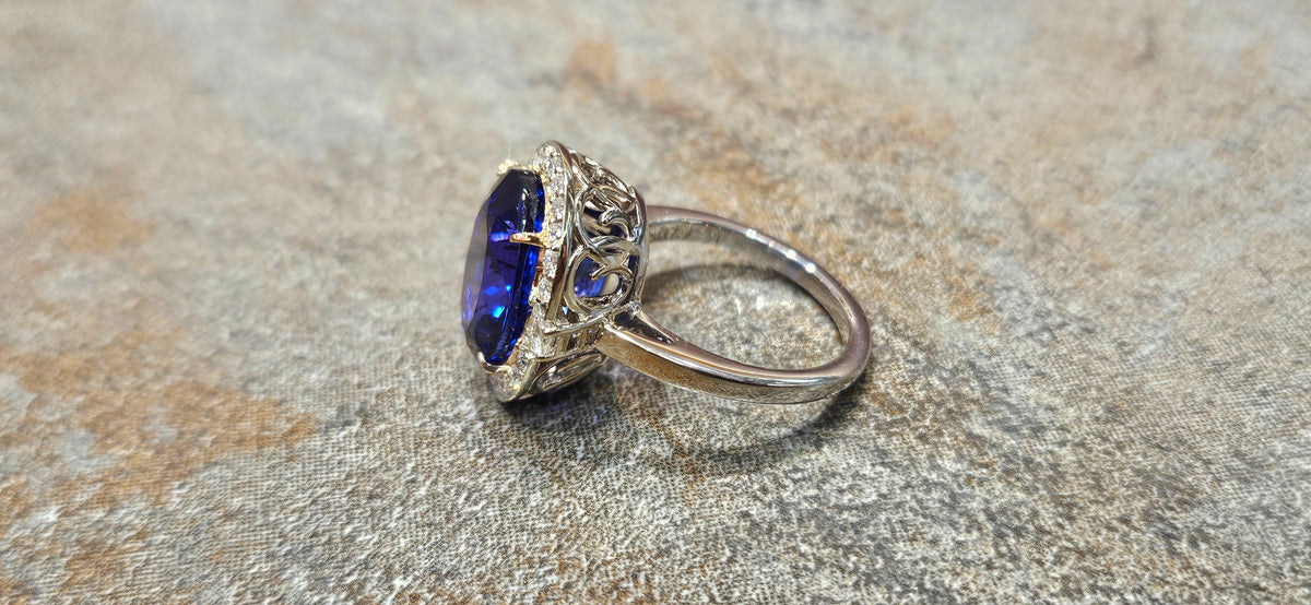 Gem blue 7.76ct Tanzanite ring in 18kw with .48cts of diamonds